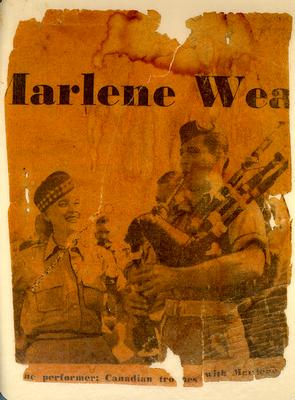 Frank McCraney playing the bagpipes for Marlene Dietrich in Italy, south of Ortona, July 1944