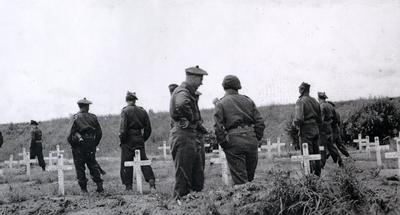 Members of the Highland Light Infantry of Canada in Bienen, Germany, visit the grave sites of friends who died in battle.