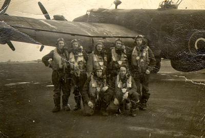 Don Bastead (back row, far right) in early 1945 with the crew of the 432 Leaside Squadron, East Moore, Yorkshire, standing beside a Halifax aircraft.