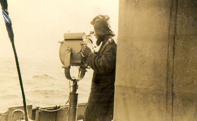 Photo taken by Geoffrey Smith showing the signalman with signal lamp on the corvette &quot;Arrowhead&quot;