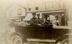 James Byron Kelley at wheel of car on Colborne Street (now Lakeshore Road), Oakville