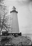 Point Pleasant Lighthouse with Man Sitting in Front