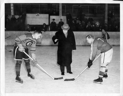 Mayor Ken Couch dropping the puck