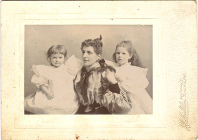 Photograph of a woman and two girls