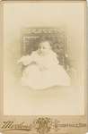 Photograph of a baby on a chair
