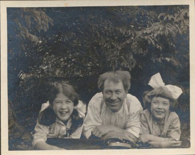 Photo of a man with two girls