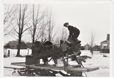 Young man playing on sledding equipment