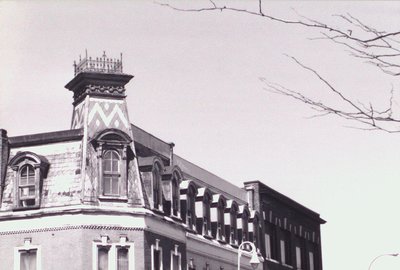 Roofline of a building at the corner of St. Paul Street and Academy Street