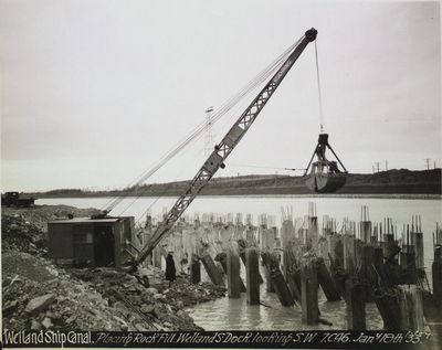 Placing rock fill, Welland South Dock, Welland Ship Canal