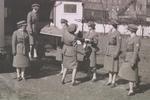 Loading stretcher into Red Cross truck