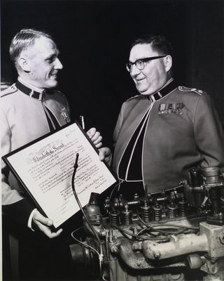 Major R.T. Hayworth, CO of the 30th Technical Squadron, RCEME, receives commission scroll, St. Catharines