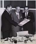 Photograph of Ivan Buchanan and unidentified officials
