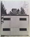 Carpenters shingling roof of Butlers Barracks