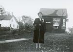 Annie Davidson in front of her small dairy booth, Oak Street, Smiths Falls