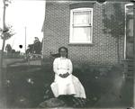 Woman in front of her home by George Little, Smiths Falls, ca. 1905