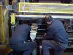 Workers doing upkeep on paper machines in Sturgeon Falls, ON