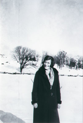 Alma with cold hands in field