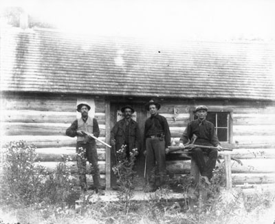 Hunters in Front of Hunting Camp
