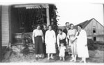 Erven Family in front of house and barn, circa 1930
