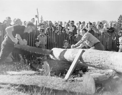 Two Men Hand-sawing a Log, South River Agricultural Society Fall Fair, circa 1960