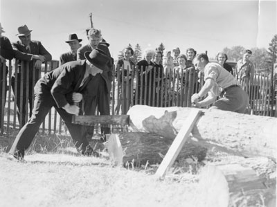 Two Men Sawing, South River Agricultural Society Fall Fair, circa 1960