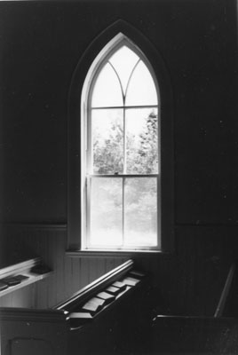 Pew and Window inside St. John's Anglican Church at Eagle Lake
