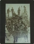 Loggers on Logs on a Sleigh Drawn by Two Horses