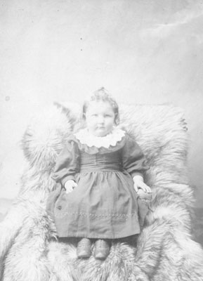 Portrait of a Young Girl Sitting in Fur