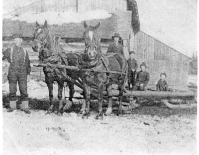 Two Horses Pulling a Sled with Three Children Riding, circa 1920