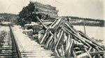Logs Next to the Railroad Tracks, March 2, 1941