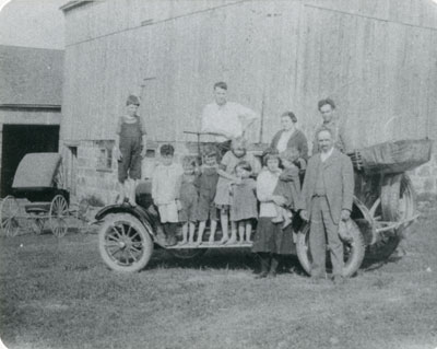 Bow Family & Friends on a Car at the Bow Farm, circa 1920