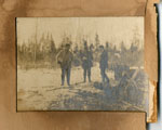 Three Men Standing Beside a Sawhorse, circa 1920