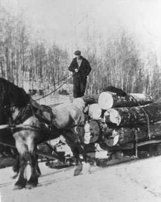 Walter Frost on Log Sled, 1944