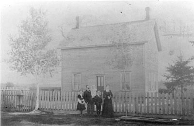 Family in Front of a House, circa 1890
