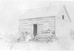 Family in front of Pioneer Whellington Home, circa 1890