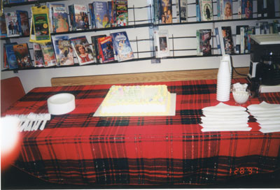 Cake Celebrating 100th Anniversary of the Sundridge Strong Library, with Video Tapes on the Wall in Background