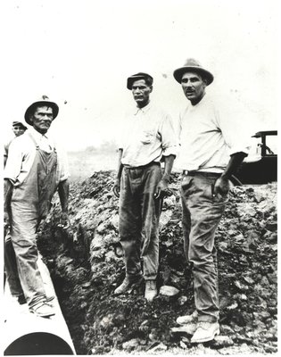 Four Men at Work Site