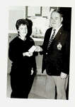 Photograph of a Legion Member and woman receiving cheque