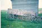 Wagon and House in Rural Saskatchewan