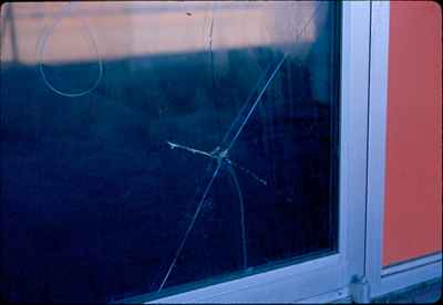 Hole in Glass of Door to Fairview Pool