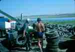 Inserting Tire Into Shredder - Swift Current Landfill Site