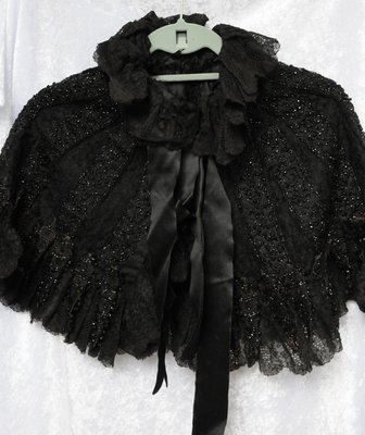 Cape Worn by Alisemon (Hardy) Wilson and Child's Dress Worn by Edna Wilson