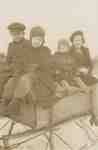 Hank, Jim, Marion, and Isobel Ford on a Homemade Sleigh.