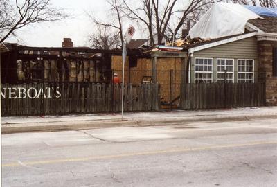 Stoneboats after fire in 2006 with blackened beams.  Bronte, Oakville. The Stoneboats building is constructed with lakestone.  Stoneboats were flat bottomed sleds used to haul stone over short distances.