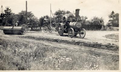 Road Grader Being Pulled By A Steam Tractor, 1913.