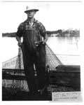 Lloyd Bellerose Lifting Fishing Nets, Bruce Mines, Circa 1940