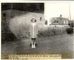 Girl in front of Thessalon Grist Mill, circa 1950