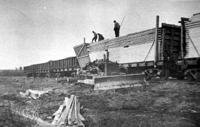 Unloading Prefabricated Bunkhouses (1945)