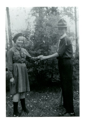 Girl Guide and Boy Scout Shake Hands