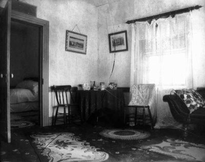 Old home parlour view with bedroom door, ca.1895.  Cavendish, P.E.I.